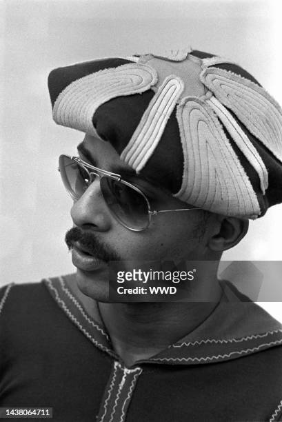 Fashion designer Stephen Burrows wearing a hat and sunglasses