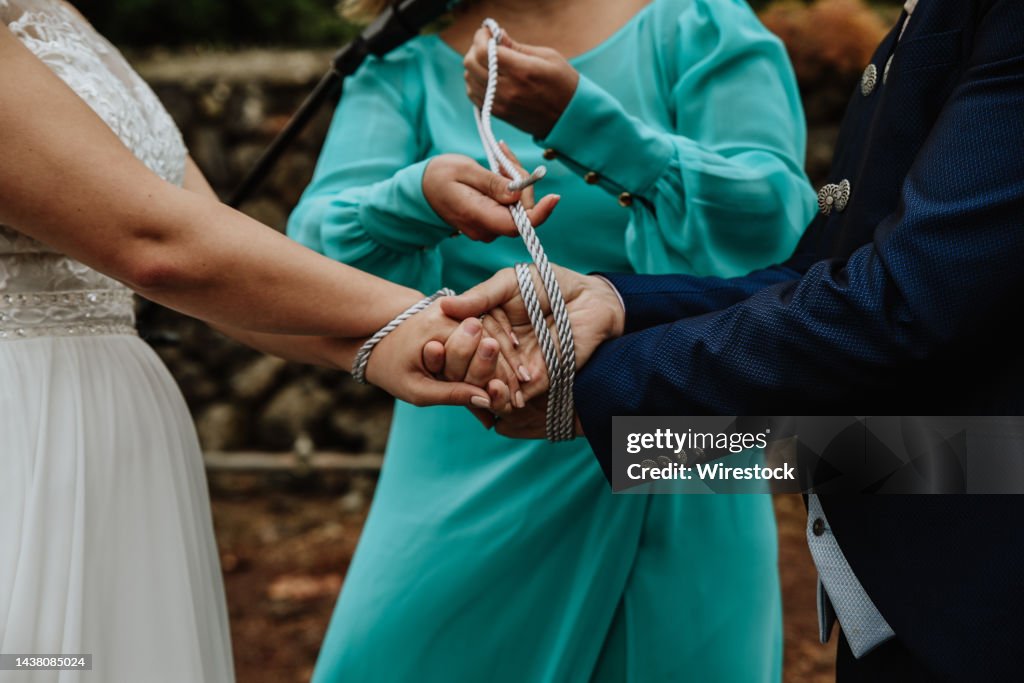 Traditional handfasting ceremony during the wedding