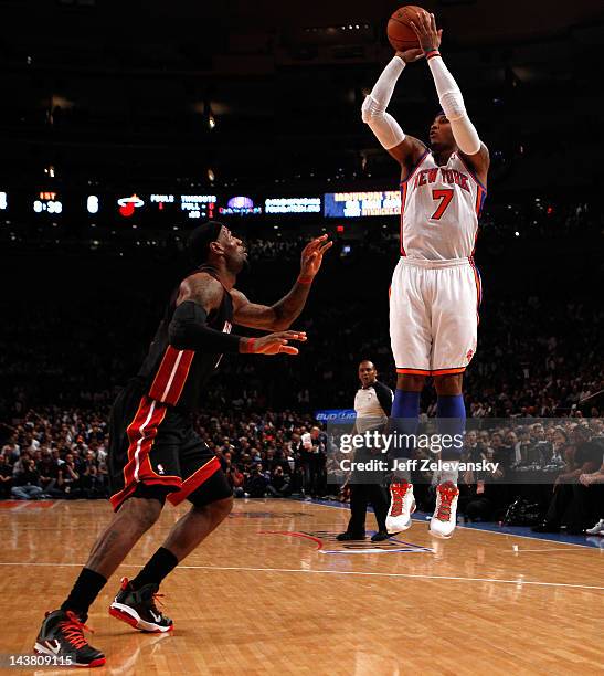 Carmelo Anthony of the New York Knicks attempts a shot in the first quarter against LeBron James of the Miami Heat in Game Three of the Eastern...