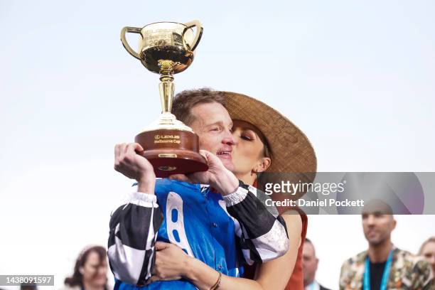 Mark Zahra who rode Gold Trip celebrates with the trophy with his wife Elyse Zahra after winning race seven, the Lexus Melbourne Cup during 2022...