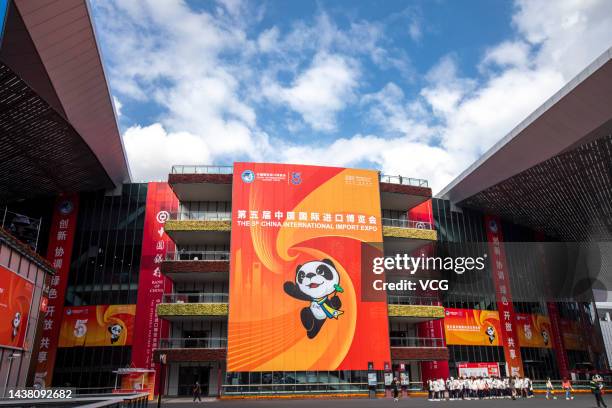 Giant poster featuring the mascot "Jinbao" of China International Import Expo is displayed at the National Exhibition and Convention Center on...