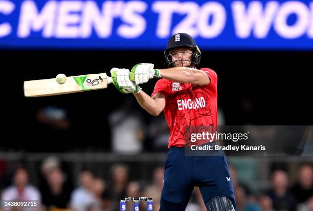 Jos Buttler of England hits the ball over the boundary for a six during the ICC Men's T20 World Cup match between England and New Zealand at The...