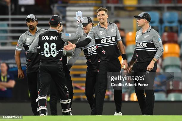 Tim Southee of New Zealand celebrates dismissing Jos Buttler of England during the ICC Men's T20 World Cup match between England and New Zealand at...