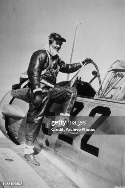 American United States Air Force captain Benjamin O Davis Jr climbing into an trainer aircraft at Tuskegee Army Air Field in Tuskegee, Alabama,...