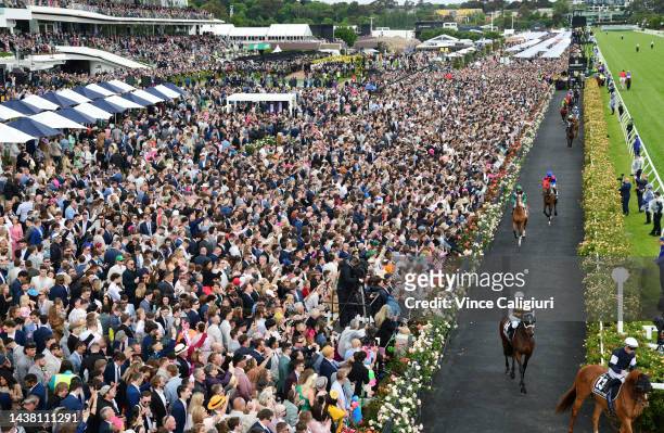 General view of crowd as horses walk onto the track before Race 7, the Lexus Melbourne Cup, during 2022 Lexus Melbourne Cup Day at Flemington...