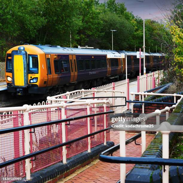 generic diesel powered railway line station in the english countryside. - midlands england stock pictures, royalty-free photos & images