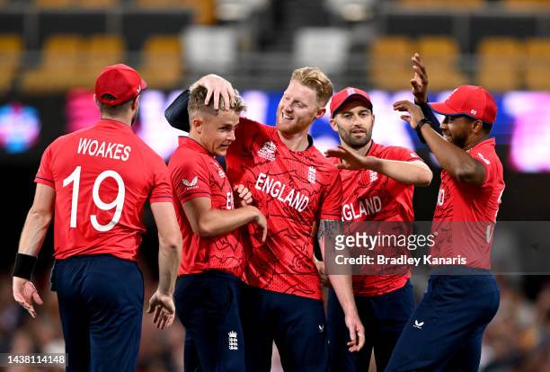 Sam Curran of England is congratulated by team mates after taking the wicket of Glenn Phillips of New Zealand during the ICC Men's T20 World Cup...
