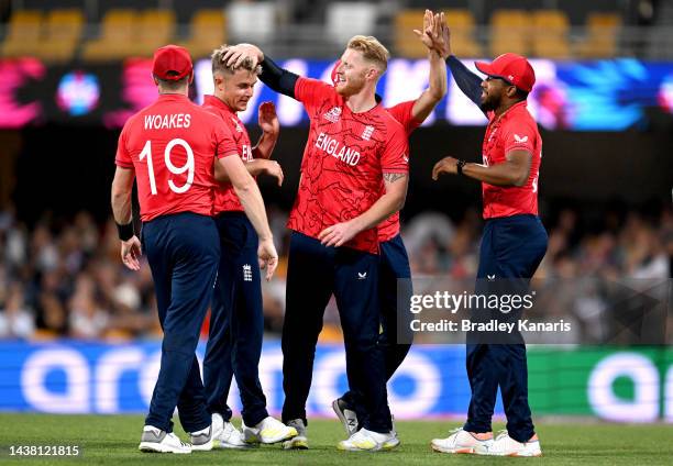 Sam Curran of England is congratulated by team mates after taking the wicket of Glenn Phillips of New Zealand during the ICC Men's T20 World Cup...