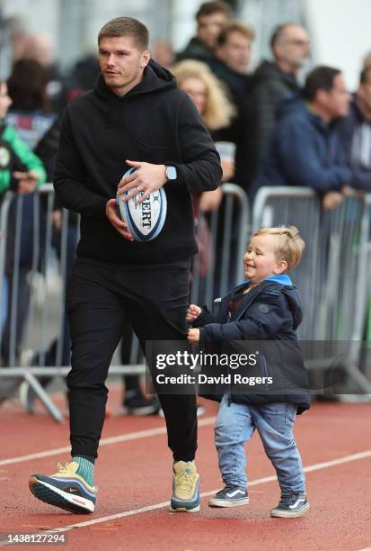 Owen Farrell of Saracens walks with his son Tommy during the Gallagher Premiership Rugby match between Saracens and Sale Sharks at the StoneX Stadium...