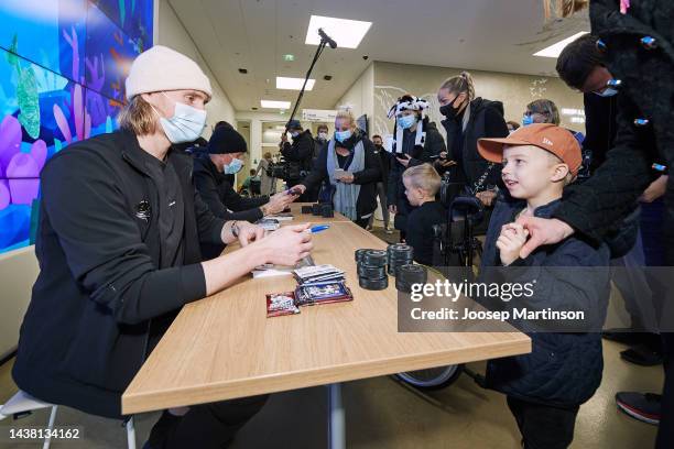 Patrick Laine and Joonas Korpisalo of Columbus Blue Jackets visit patients at Uusi Lastensairaala Hospital on November 01, 2022 in Helsinki, Finland.