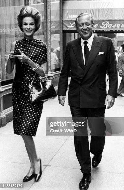 William and Babe Paley walking on a Manhattan street, outside of La Cote Basque.