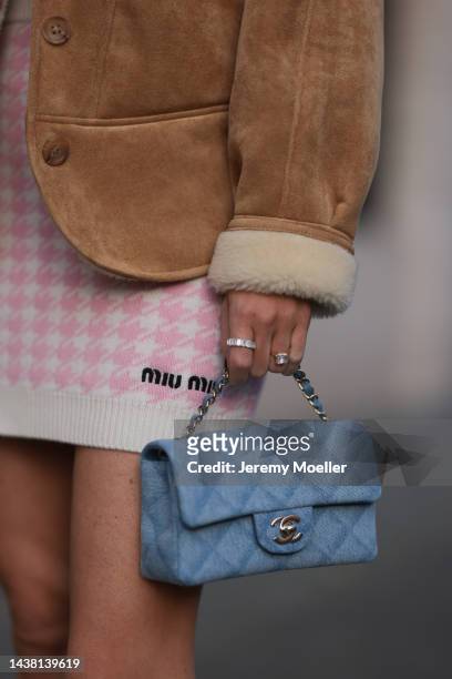 Leo Eberlin seen wearing a MiuMiu knit checked white rose mini skirt, Leo Mathild jewelry, a Chanel blue denim flapbag and a Lvir beige wild leather...