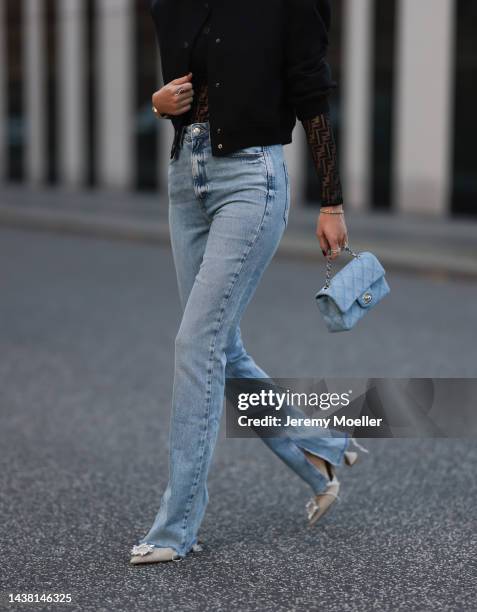 Leo Eberlin seen wearing Zara denim pants, a Fendi black transparent logo top, a Chanel denim blue flapbag, a Zara black cropped bomberjacket, Leo...