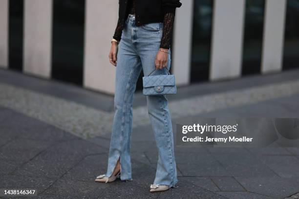 Leo Eberlin seen wearing Zara denim pants, a Fendi black transparent logo top, a Chanel denim blue flapbag, a Zara black cropped bomberjacket, Leo...