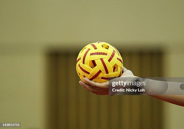 Malaysia serves against China during their women's match on day two of the ISTAF Super Series at ITE Campus on May 4, 2012 in Singapore.