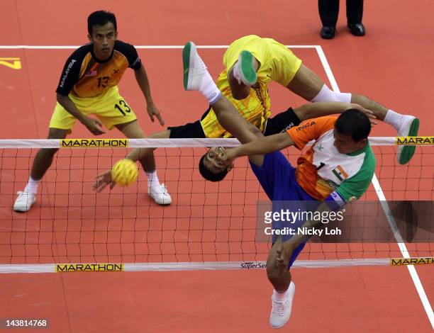 Mohd Fadzli Bin Muhd. Roslan of Malaysia returns a shot to India during their men's match on day two of the ISTAF Super Series at ITE Campus on May...