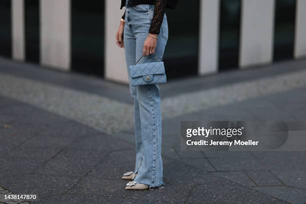 Leo Eberlin seen wearing Zara denim pants, a Fendi black transparent logo top, a Chanel denim blue flapbag, a Zara black cropped bomberjacket, Leo...