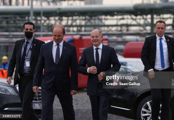 German Chancellor Olaf Scholz walks with BASF CEO Martin Brudermueller upon his arrival to visit the BASF plant on November 01, 2022 in Schwarzheide,...