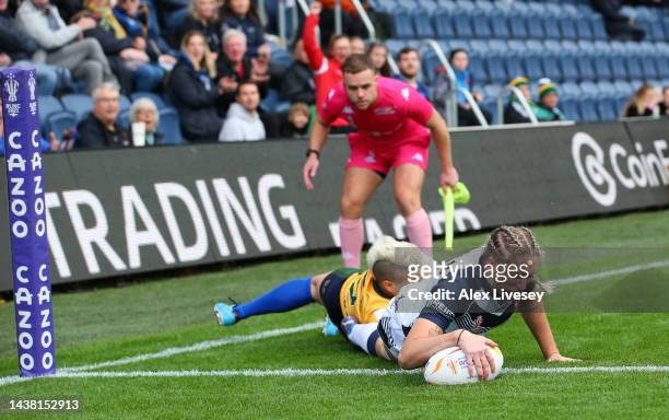 Caitlin Beevers of England touches down for their team's first try during the Women's Rugby League World Cup Group A match between England Women and...