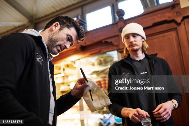 Joonas Korpisalo and Erik Gudbranson of Columbus Blue Jackets visit Finnish Food Hall on November 01, 2022 in Helsinki, Finland.