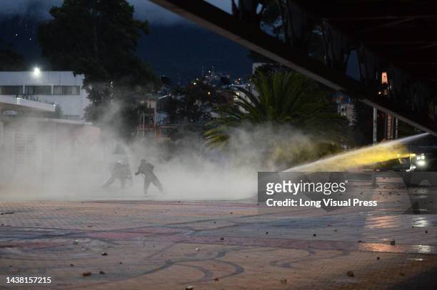 Demonstrators clash with Colombia's anti-riot police squadron formerly known as ESMAD clashes as protests rise in Bogota, Colombia amid the...