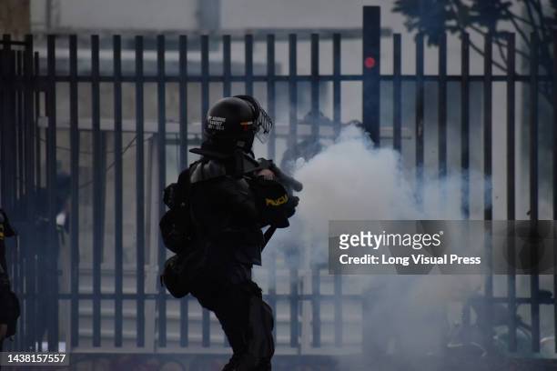Colombia's anti-riot police squadron formerly known as ESMAD clashes with demonstrators as protests rise in Bogota, Colombia amid the liberation of...