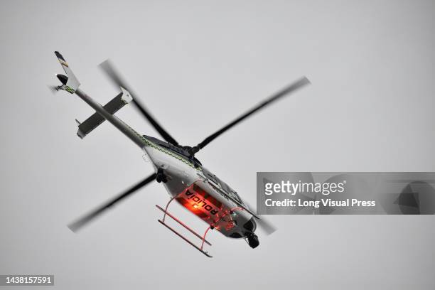 Colombian police helicopter is seen patrolling as protests rise in Bogota, Colombia amid the liberation of political prisoners captured during the...