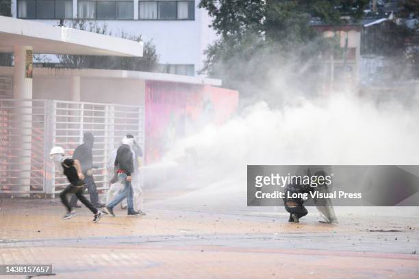 Demonstrators clash with Colombia's anti-riot police squadron formerly known as ESMAD clashes as protests rise in Bogota, Colombia amid the...
