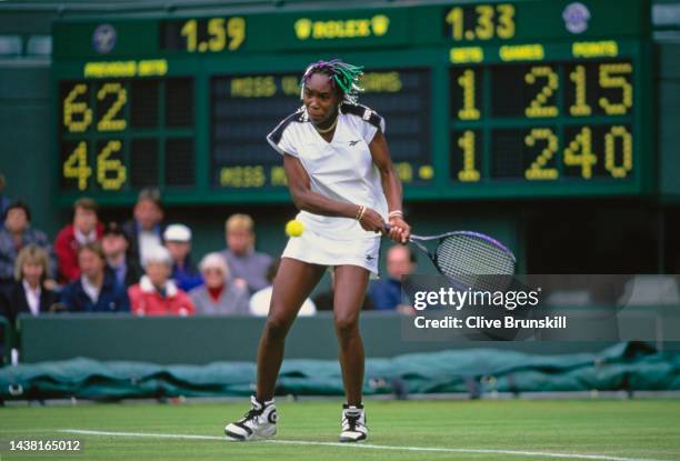 Venus Williams from the United States plays a double handed backhand return against Magdalena Grzybowska of Poland during their the Women's Singles...