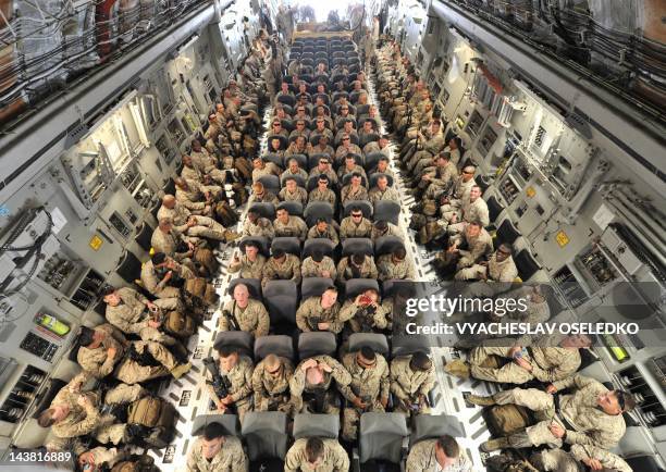 Servicemen inside of a plane before their departure to Afghanistan from the US transit center Manas, 30 km outside the Kyrgyzstan's capital Bishkek,...