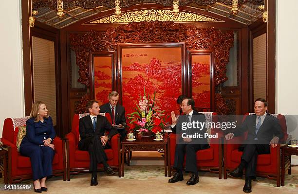 Secretary of State Hillary Clinton and Treasury Secretary Timothy Geithner talk to China's Premier Wen Jiabao and Vice Premier Wang Qishan during a...
