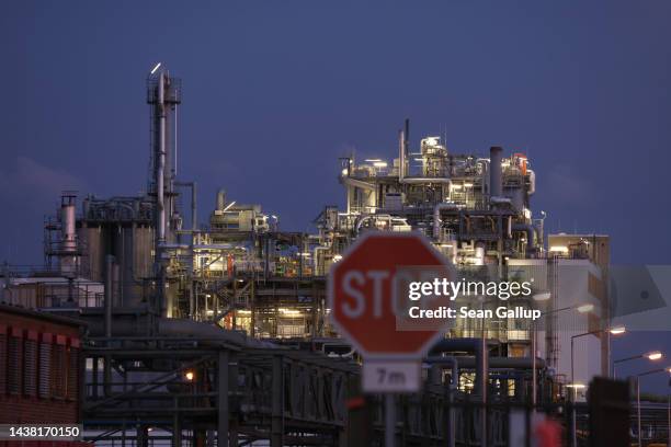 The BASF plant stands illuminated behind a stop sign on November 01, 2022 in Schwarzheide, Germany. The plant, which makes chemical products, relies...