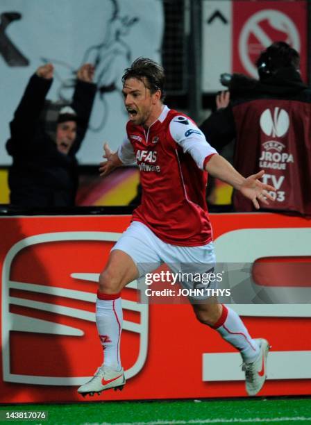 Alkmaar 's forward Brett Holman celebrates after scores against Valencia during the UEFA Europa League quarter final football match in Alkmaar on...