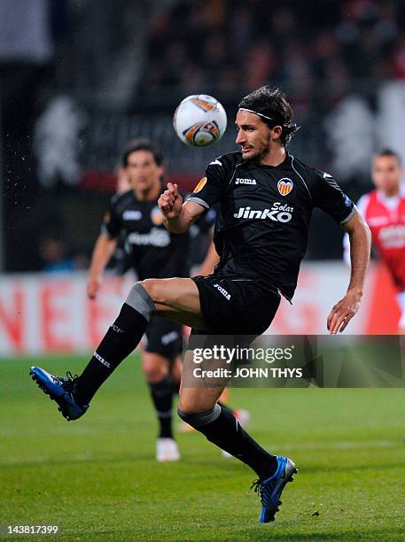 Valencia's Turkish midfielder Mehmet Topal shoots during the UEFA Europa League quarter-final first leg football match between AZ Alkmaar and...