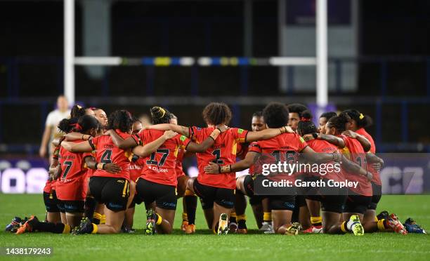 Players of Papua New Guinea take a knee prior to the Women's Rugby League World Cup Group A match between Papua New Guinea Women and Canada Women at...