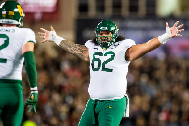 Defensive lineman Siaki Ika of the Baylor Bears reacts during the first half of the game against the Texas Tech Red Raiders at Jones AT&T Stadium