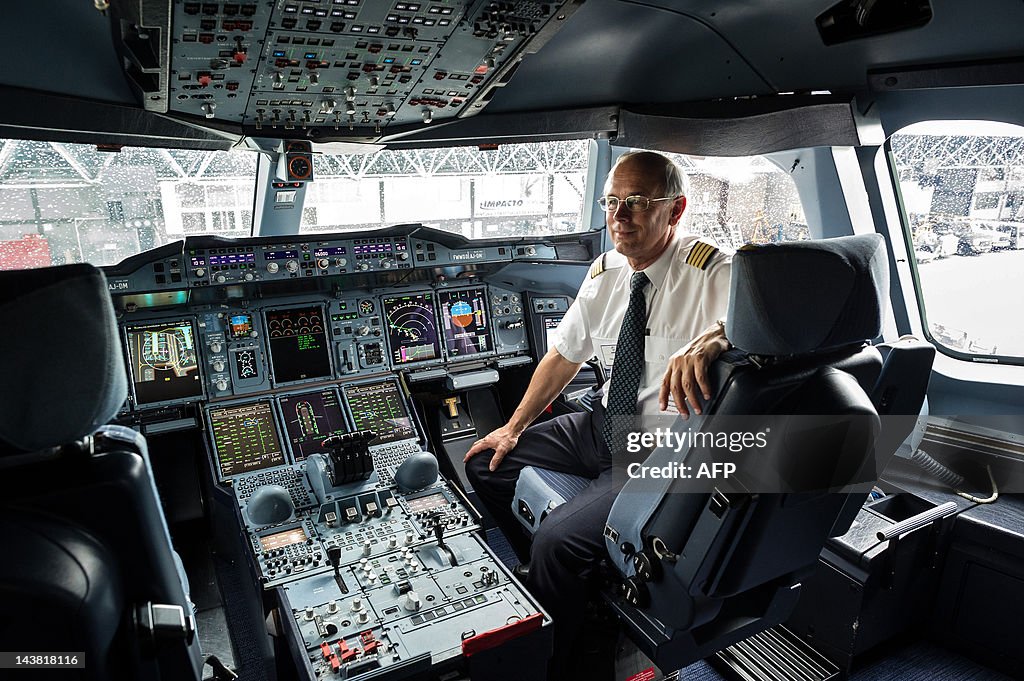 A pilot poses at the cockpit of European