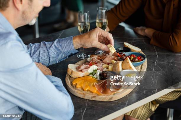 eating at a luxury restaurant - food on cutting board stock pictures, royalty-free photos & images