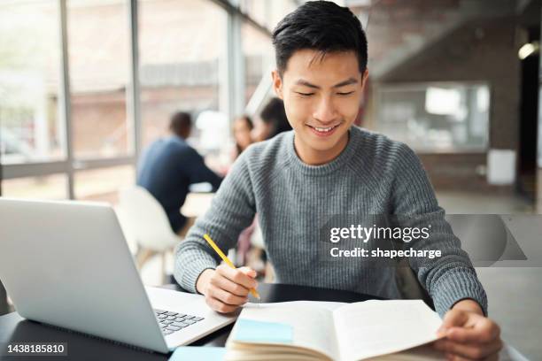 asian man, laptop and notebook in education, learning or study on college, university or japanese school campus. smile, happy and graduate for law student with technology and legal scholarship books - scholarship award stock pictures, royalty-free photos & images