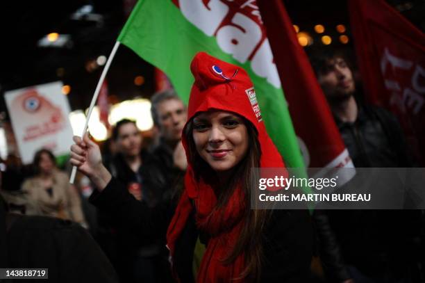 Supporter of the Front de Gauche leftist party's candidate for the 2012 French presidential election holds a flag during a campaign meeting on April...
