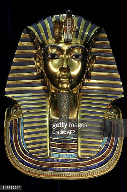 Replica of the death mask of Egyptian pharaoh Tutankhamun is on display on April 8, 2009 at the exhibition "Tutankhamun - His Tomb and his Treasures"...