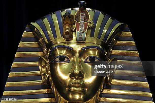 Replica of the death mask of Egyptian pharaoh Tutankhamun is on display on April 8, 2009 at the exhibition "Tutankhamun - His Tomb and his Treasures"...