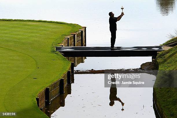 European Captain Sam Torrance of Scotland hoists the Ryder Cup after Europe defeated the United States in the 34th Ryder Cup at the De Vere Belfry in...