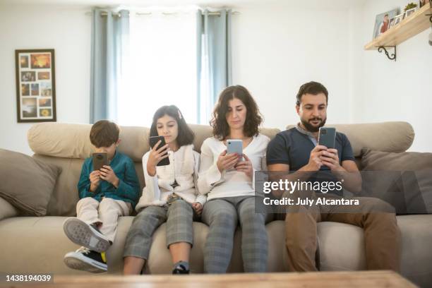 Using Phones In House 1,151 Home Phone Serious Family Stock Photos, High-Res Pictures, and ...