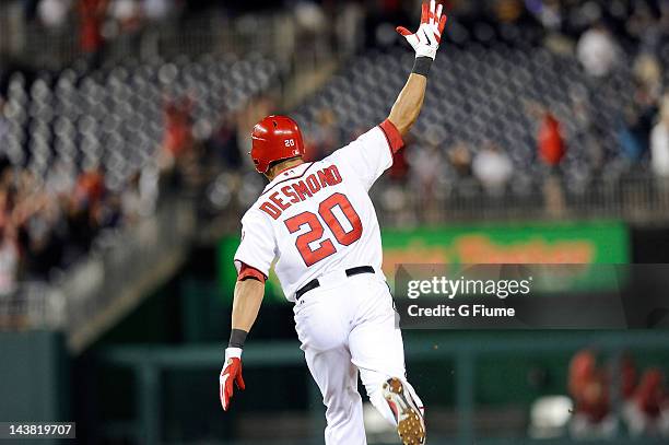 Ian Desmond of the Washington Nationals celebrates after hitting the game winning home run in the ninth inning against the Arizona Diamondbacks at...