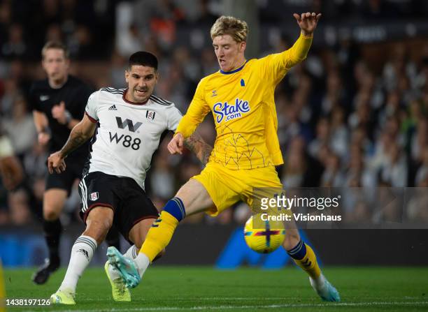 Aleksandar Mitrovic of Fulham takes a shot on goal as Anthony Gordon of Everton attempts to block during the Premier League match between Fulham FC...
