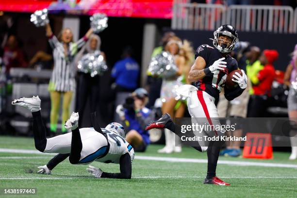 Damiere Byrd of the Atlanta Falcons breaks away from Xavier Woods of the Carolina Panthers for a touchdown during the second half at Mercedes-Benz...