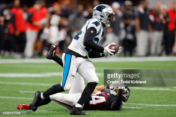 Henderson of the Carolina Panthers makes an interception over Damiere Byrd of the Atlanta Falcons in overtime at Mercedes-Benz Stadium on October 30,...