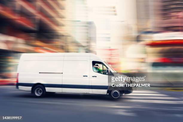 delivery white van in manhattan around times square area - delivery van stock pictures, royalty-free photos & images