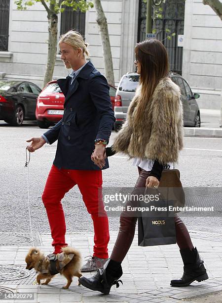 Spanish football player Jose Maria Gutierrez, Guti, and his girlfriend, Argentinian Tv presenter Romina Belluscio, are seen with their pet dog on...